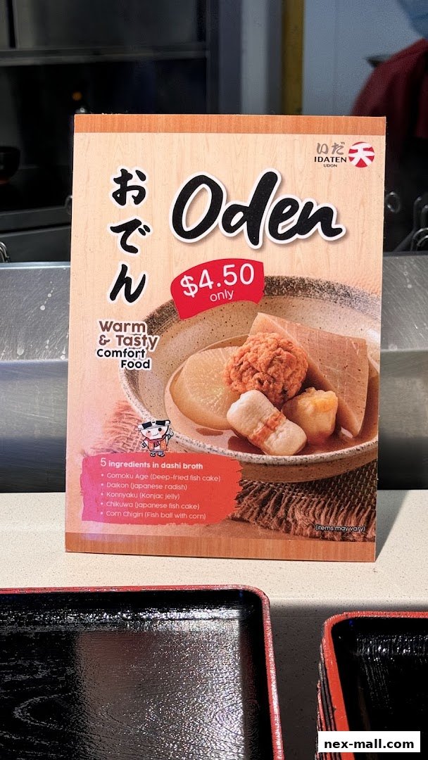 A sign advertising Oden, a Japanese comfort food, with a price and list of ingredients.