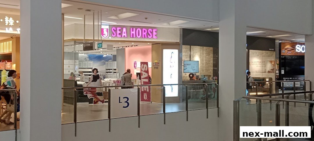 The Sea Horse shop front in NEX Mall, featuring bright pink signage and displays of home furnishings.