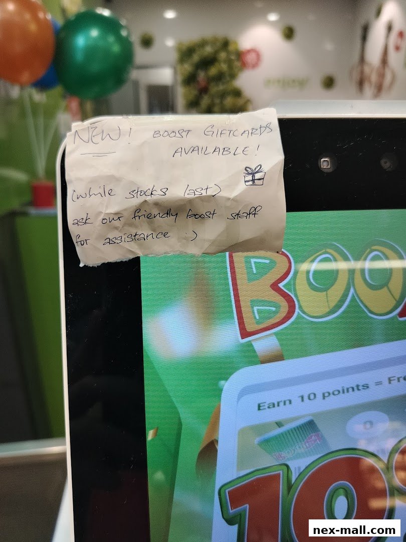 A handwritten note announcing new Boost gift cards available at the shop.