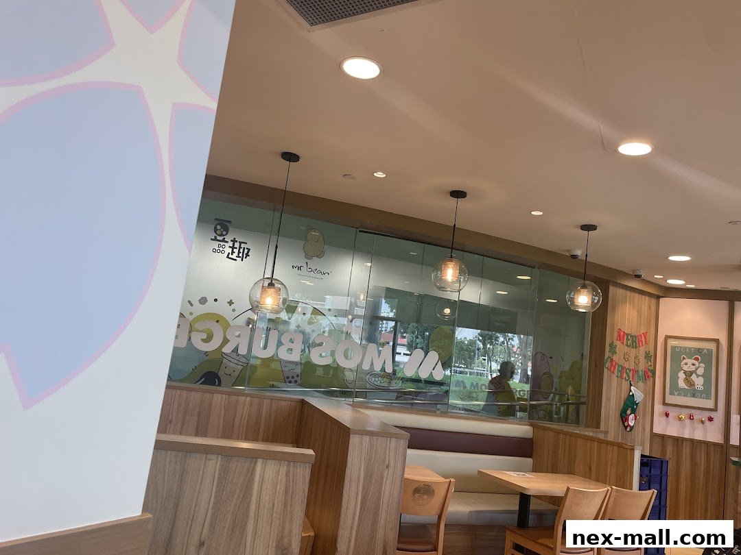 Interior view of MOS Burger with seating, tables, and decorative elements.