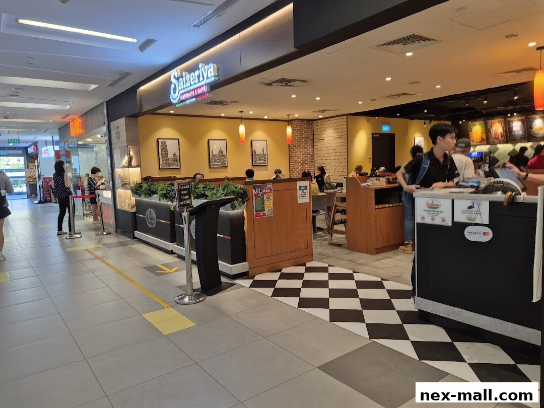 The exterior of the Saizeriya restaurant with customers queuing and dining inside.