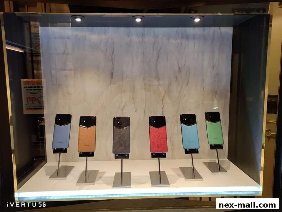 A display case showcasing several luxury smartphones in various colors.