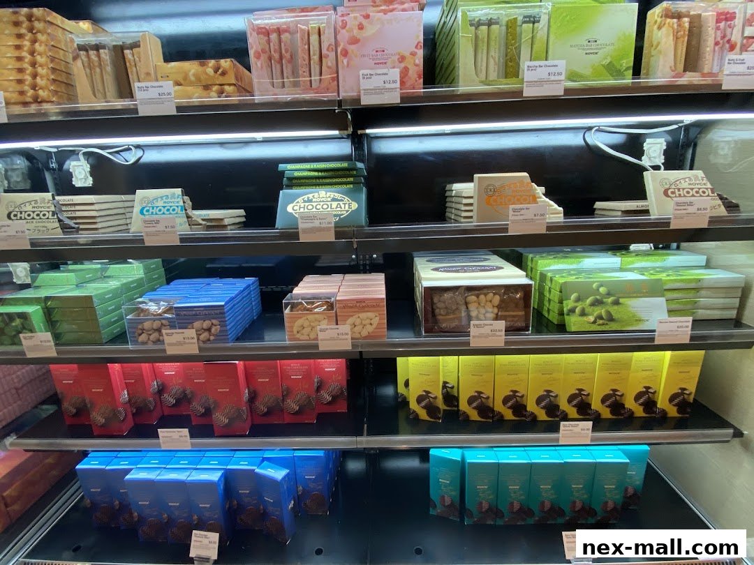 Shelves stocked with various Royce chocolate boxes and bars, neatly arranged.