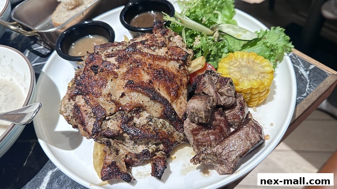 A plate of grilled meat, corn, salad, and dipping sauces.