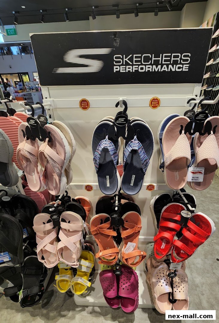 A display of Skechers Performance sandals and flip-flops in various colors and styles.