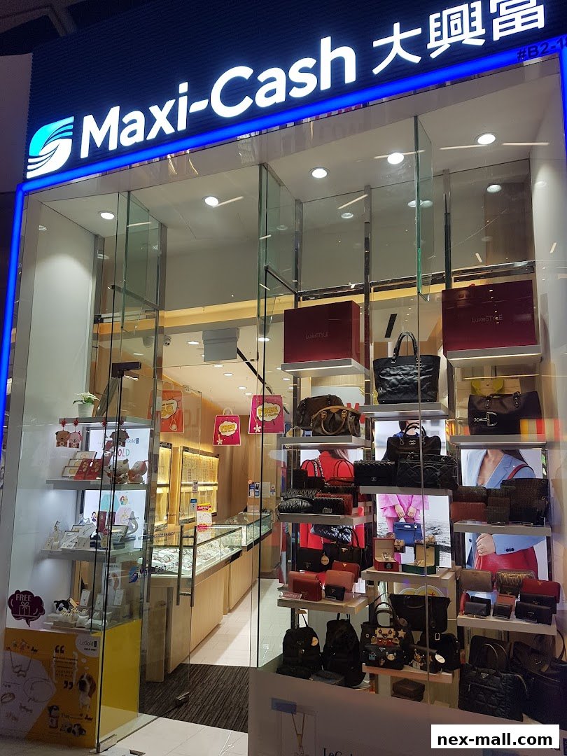 Maxi-Cash store front displaying a variety of luxury bags, jewelry, and accessories.