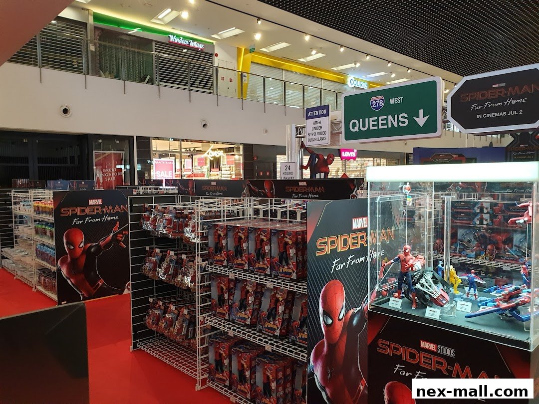 A retail display featuring Spider-Man merchandise, including action figures and promotional posters.