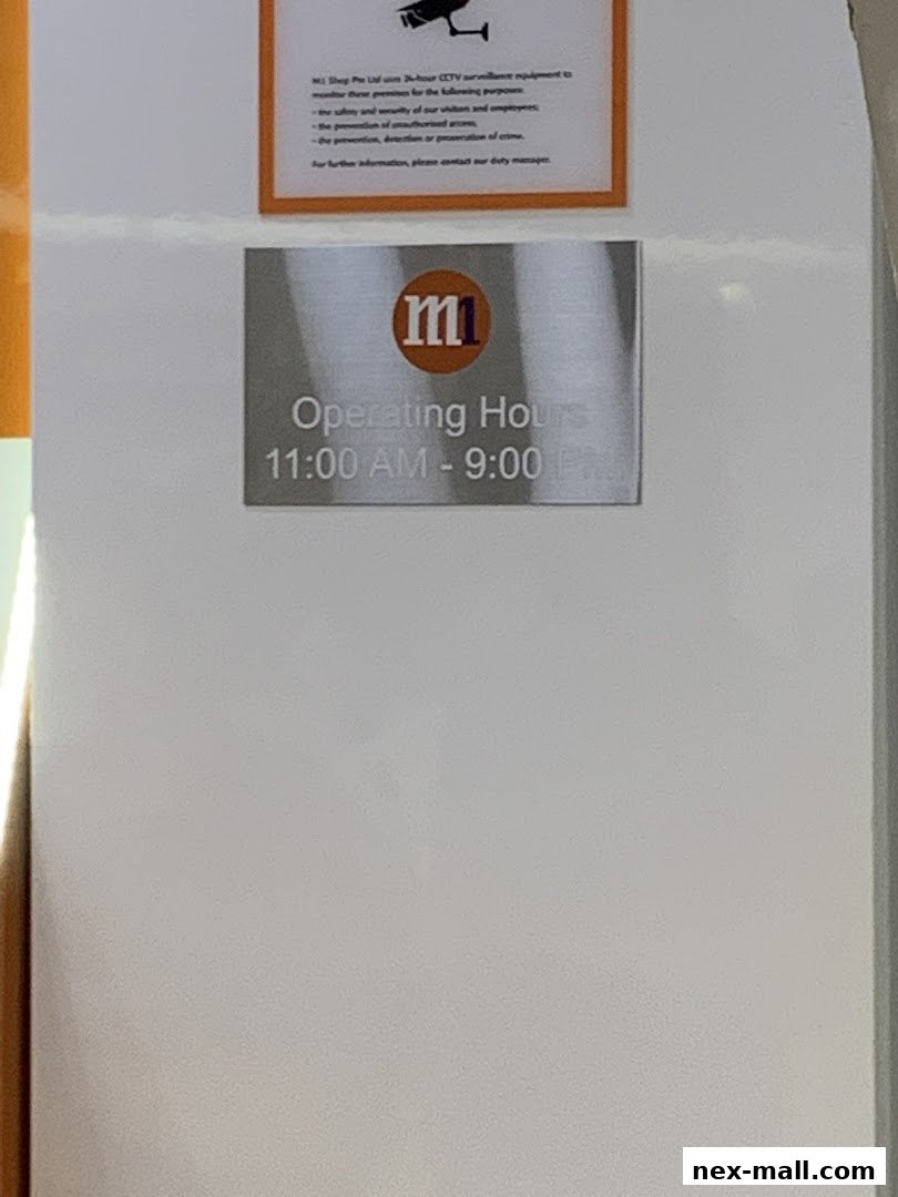 A sign displaying the M1 logo and operating hours for a phone shop.