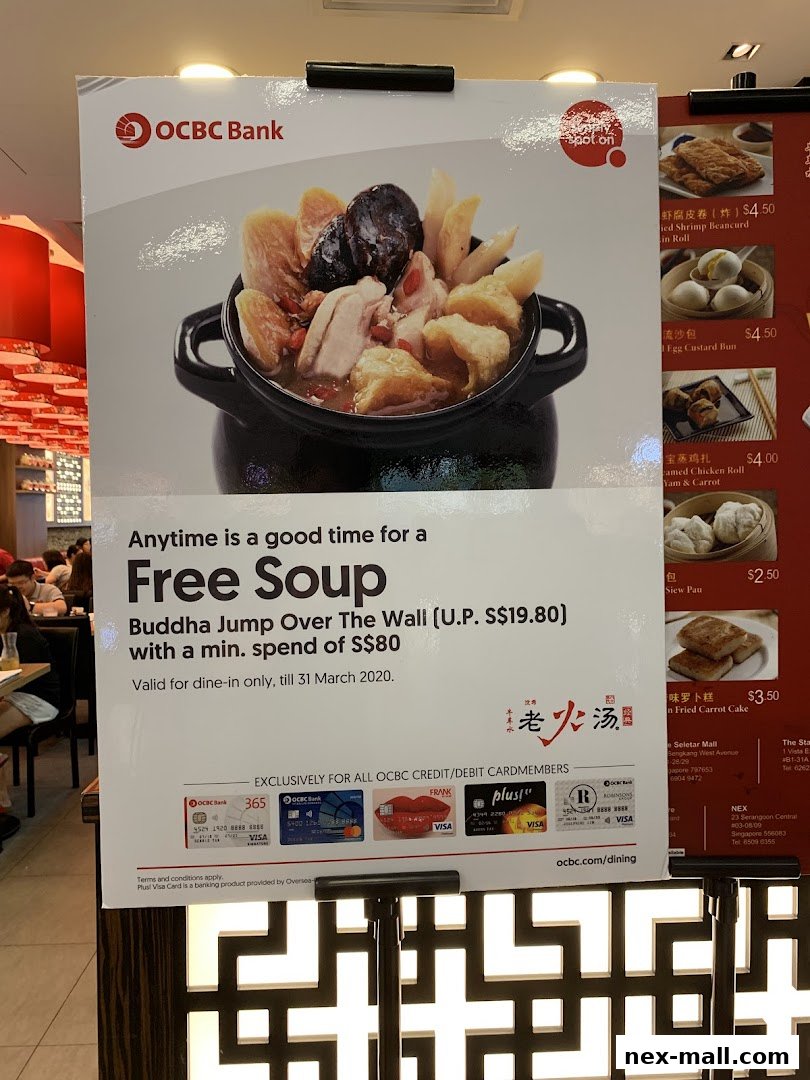 A promotional poster for Lao Huo Tang offering free soup with a minimum spend.