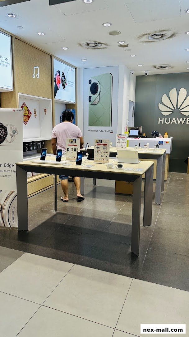 Interior of a Huawei Concept Store with display tables showcasing phones and watches.