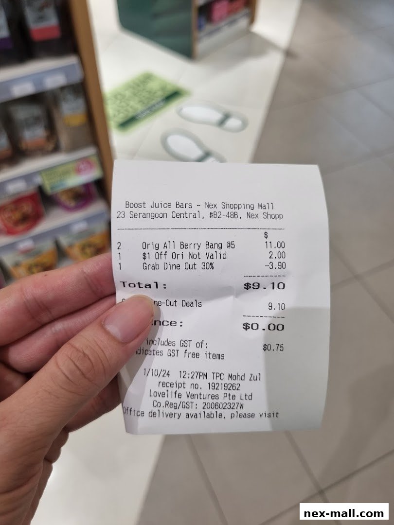 A receipt from Boost Juice Bars showing purchased items and total cost.