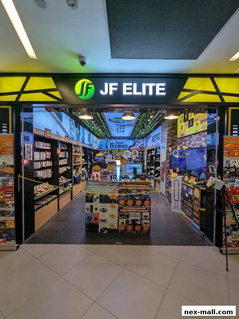 The entrance of JF Elite NEX, a shop selling electronics and accessories, with products displayed inside.