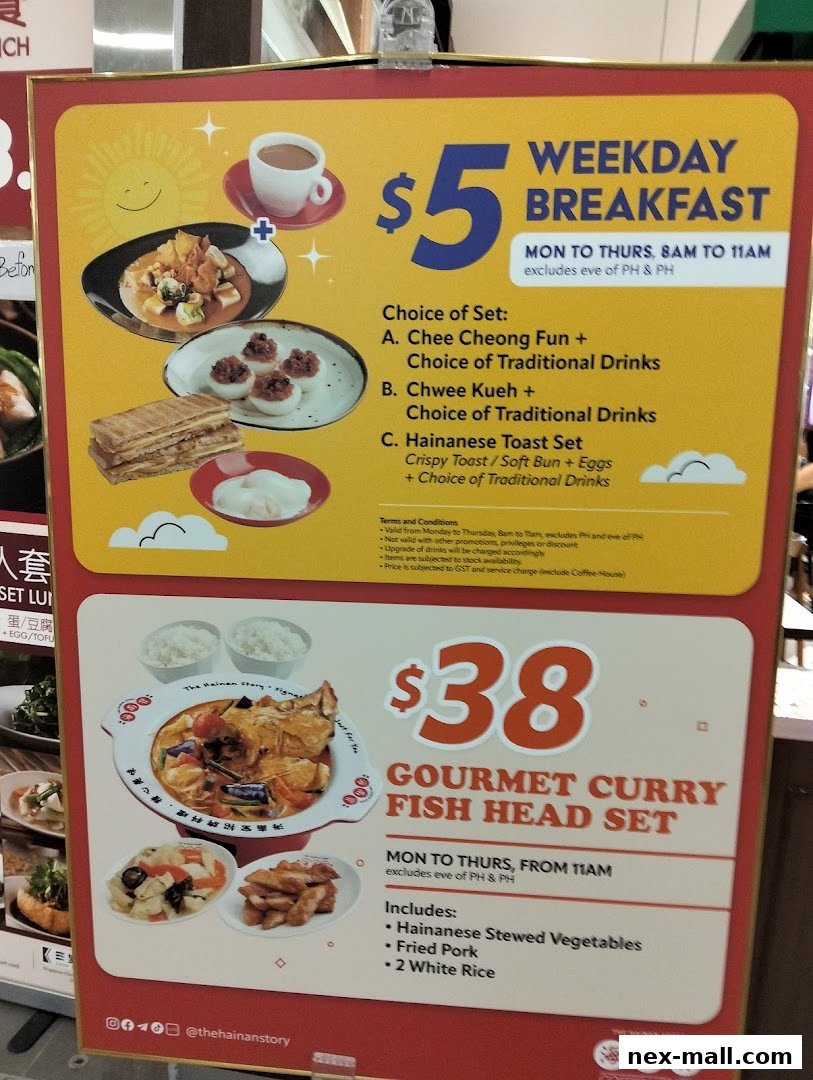 A menu board showcasing a $5 weekday breakfast set and a $38 gourmet curry fish head set.