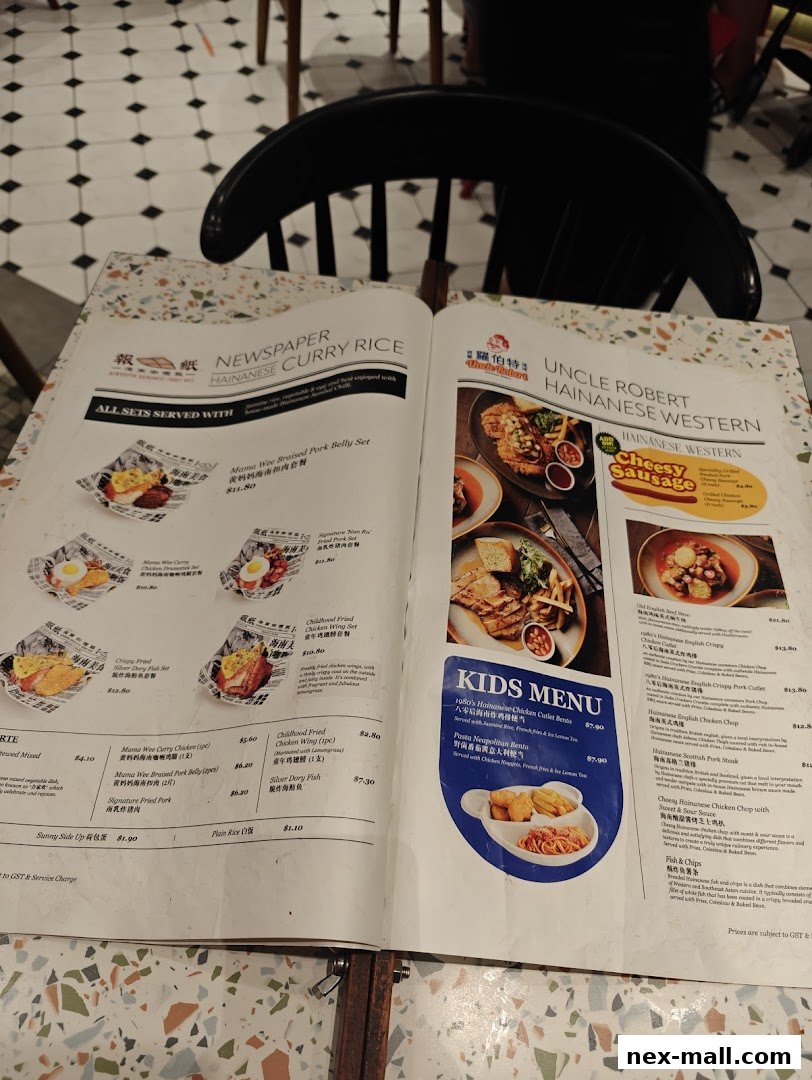 A menu from The Hainan Story Coffee House Nex, featuring Hainanese Curry Rice and Hainanese Western dishes.