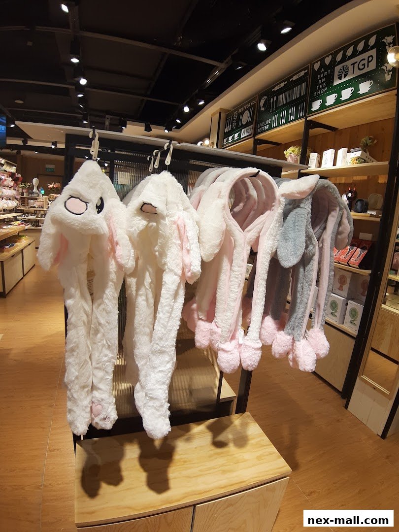 A display of fluffy animal-themed hats with long ears and paws.