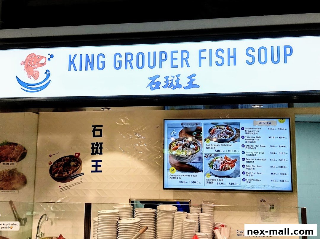 A digital menu board displaying various fish soup options with prices.