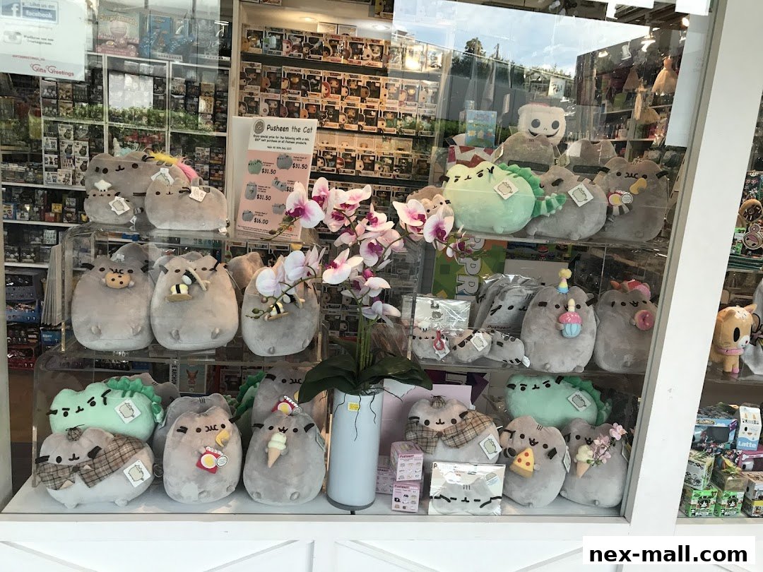 A shop window display filled with various Pusheen the Cat plush toys and merchandise.