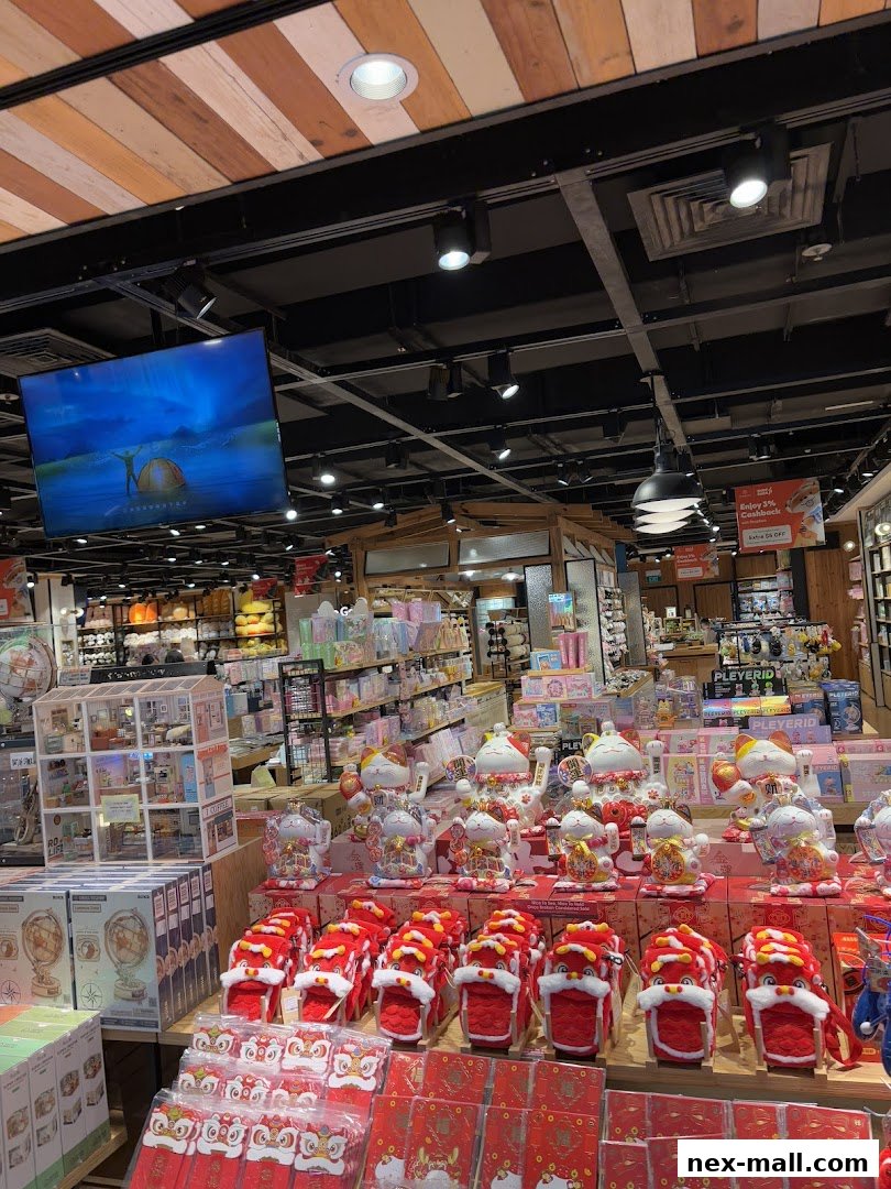 Interior view of a shop filled with various decorative items and gifts, including lucky cats and lion dance figures.