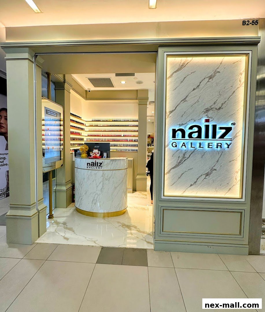 The entrance to Nailz Gallery, a nail salon with a marble reception desk and extensive nail polish displays.