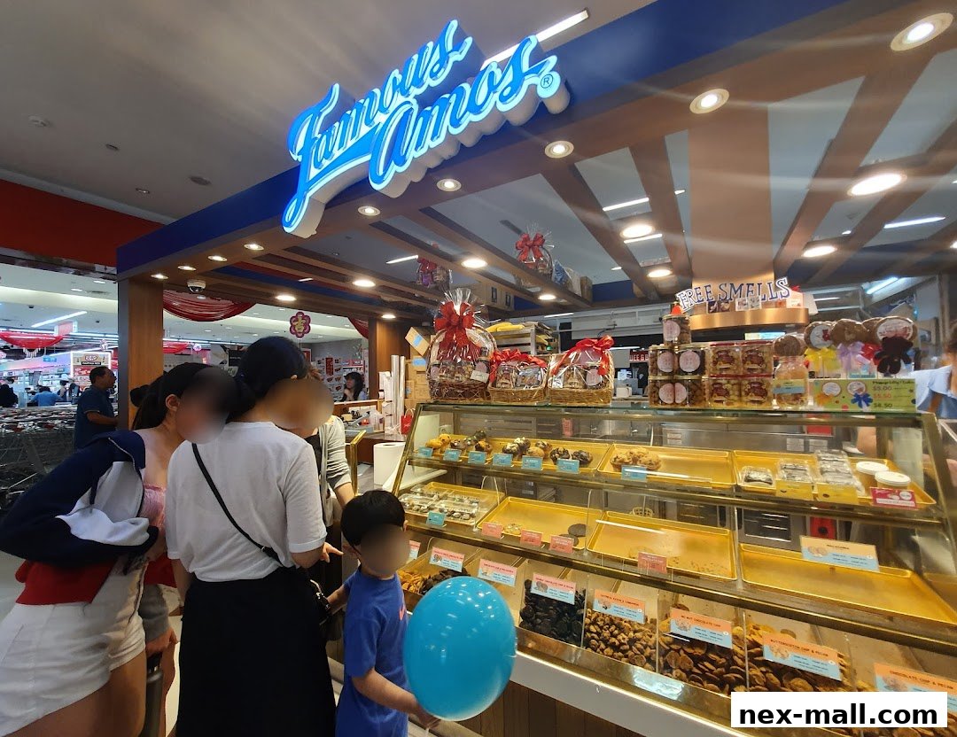 A Famous Amos cookie shop with a display of cookies and gift baskets.