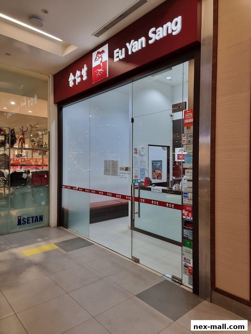 The entrance of Eu Yan Sang TCM Clinic at Serangoon NEX, featuring its prominent signage and glass doors.