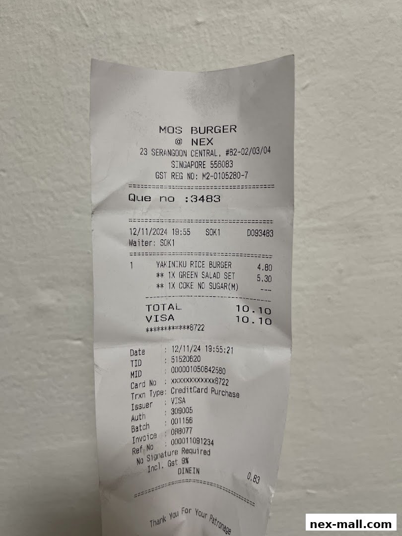 A receipt from MOS Burger showing a Yakiniku Rice Burger, Green Salad Set, and Coke.