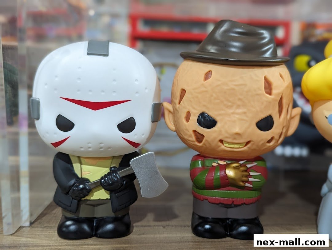 Two stylized collectible figures, Jason Voorhees and Freddy Krueger, displayed on a shelf.