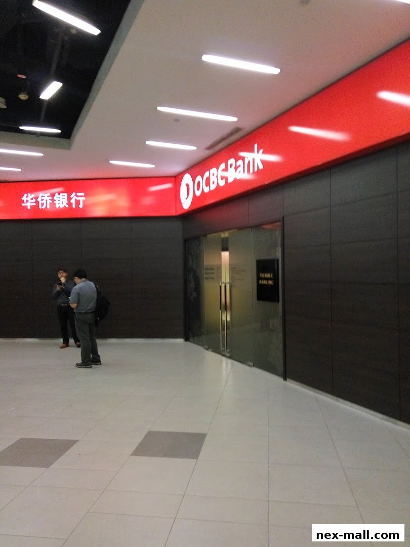 The entrance to OCBC Bank at NEX, with prominent signage and glass doors.