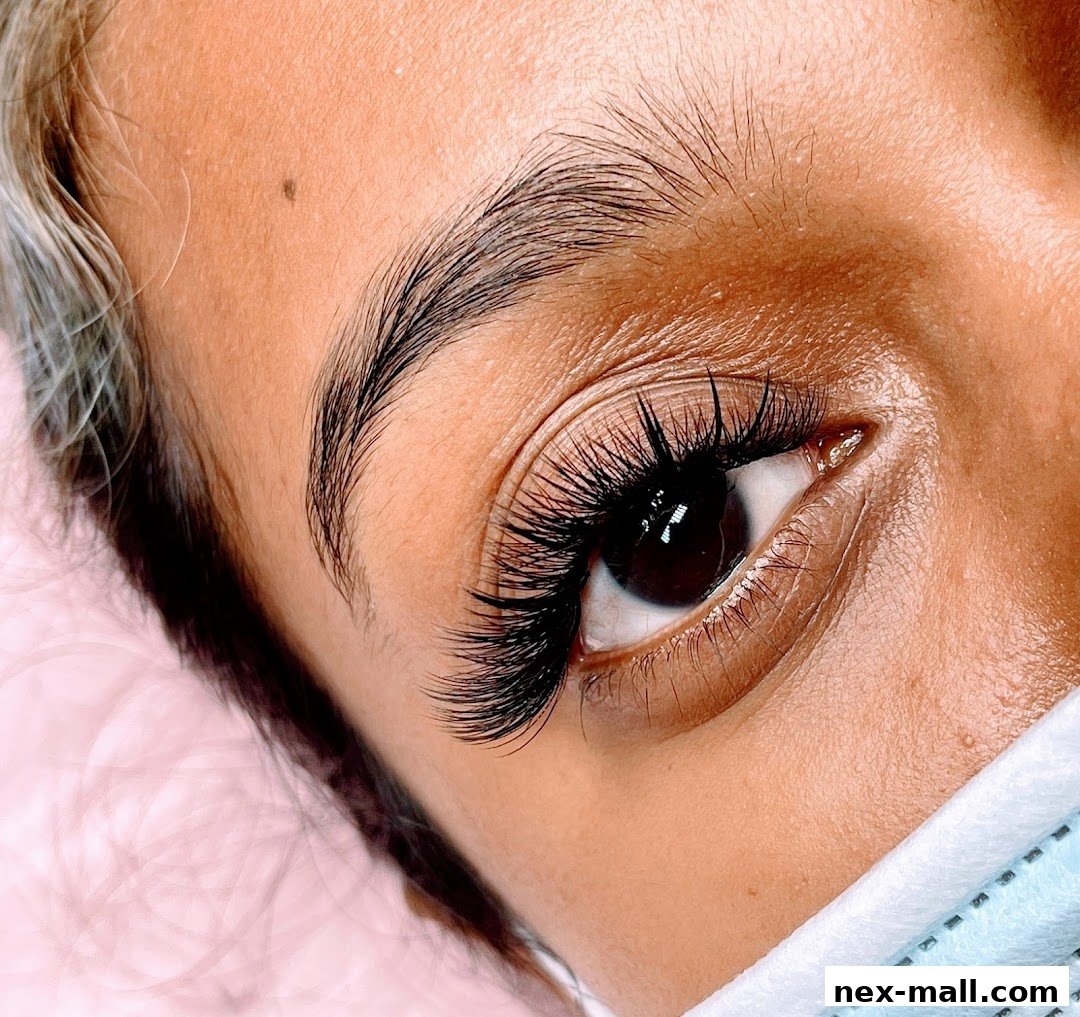 Close-up of a woman's eye with voluminous, perfectly applied eyelash extensions.