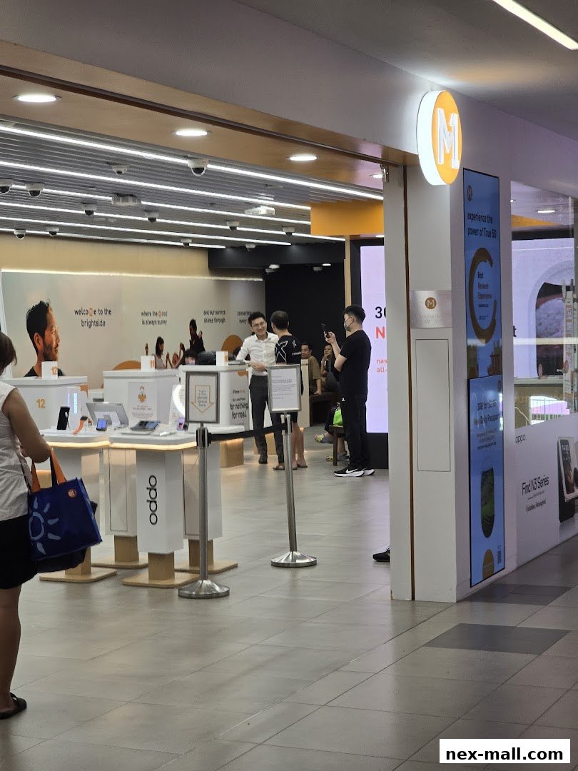 Interior view of a modern phone shop with display units and staff assisting customers.