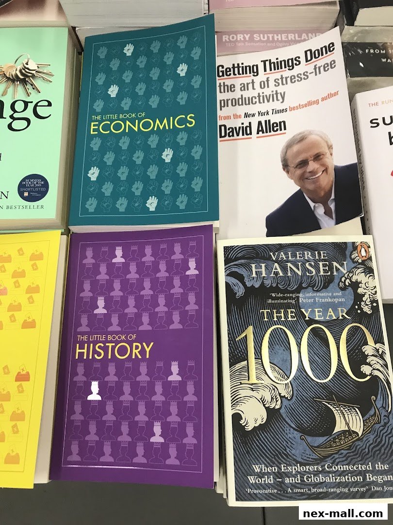 A selection of books including titles on economics, history, productivity, and global events.