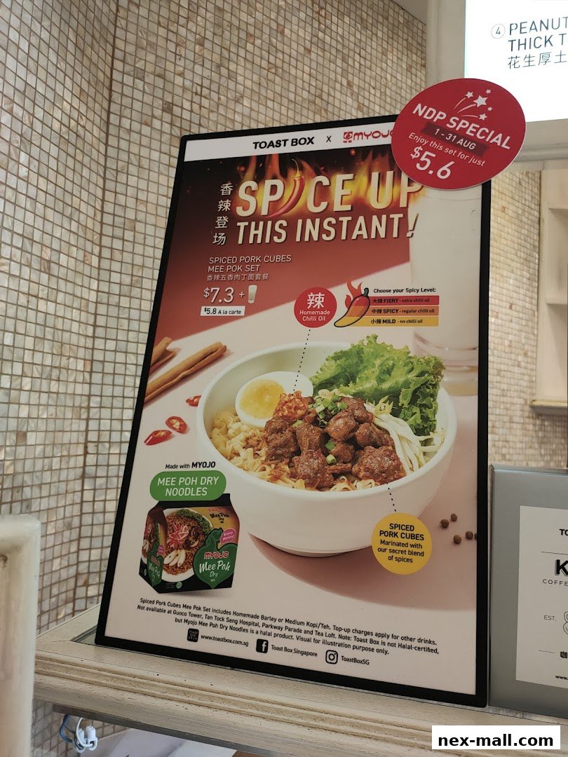 A promotional sign for Toast Box's Spiced Pork Cubes Mee Pok Set with customizable spice levels.