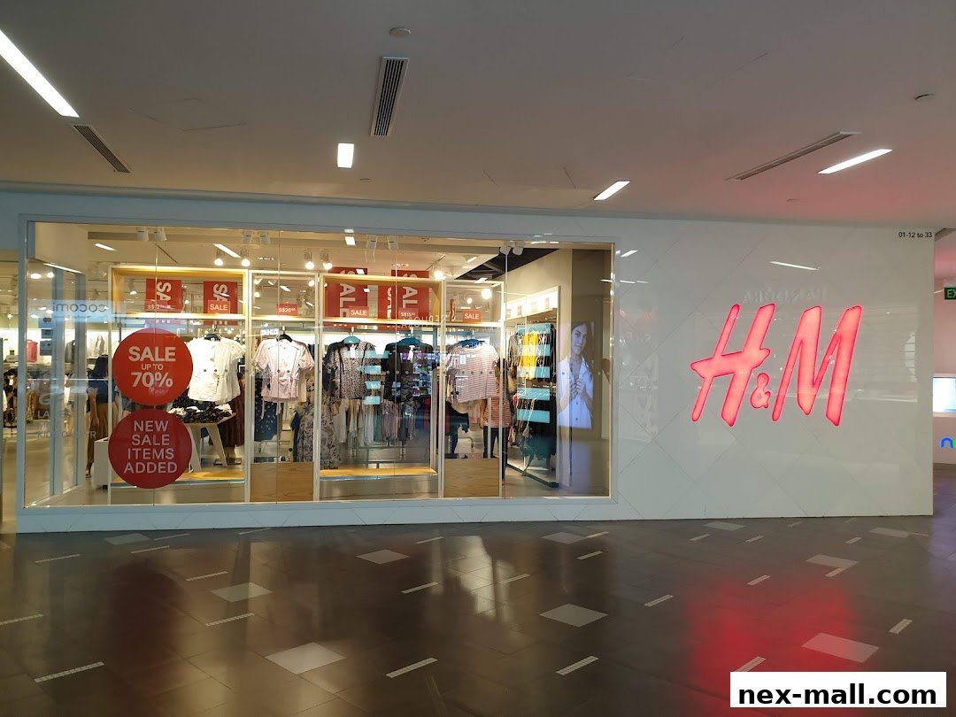 The H&M store front with a sale display and the H&M logo.