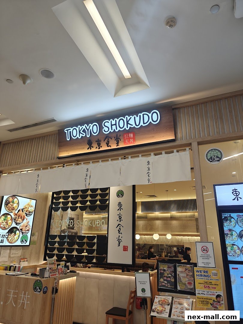 The exterior of Tokyo Shokudo, a Japanese restaurant, with its prominent signage and inviting interior.