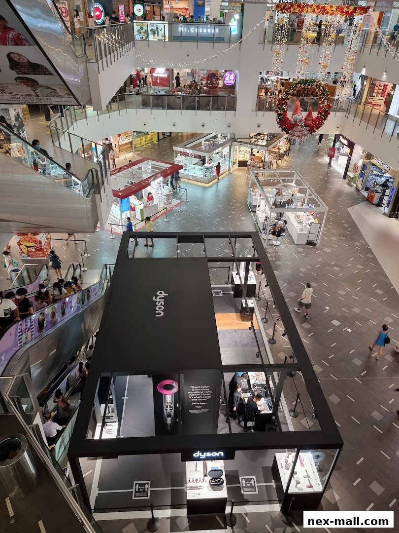 A high-angle view of a Dyson store in a shopping mall, showcasing products and displays.