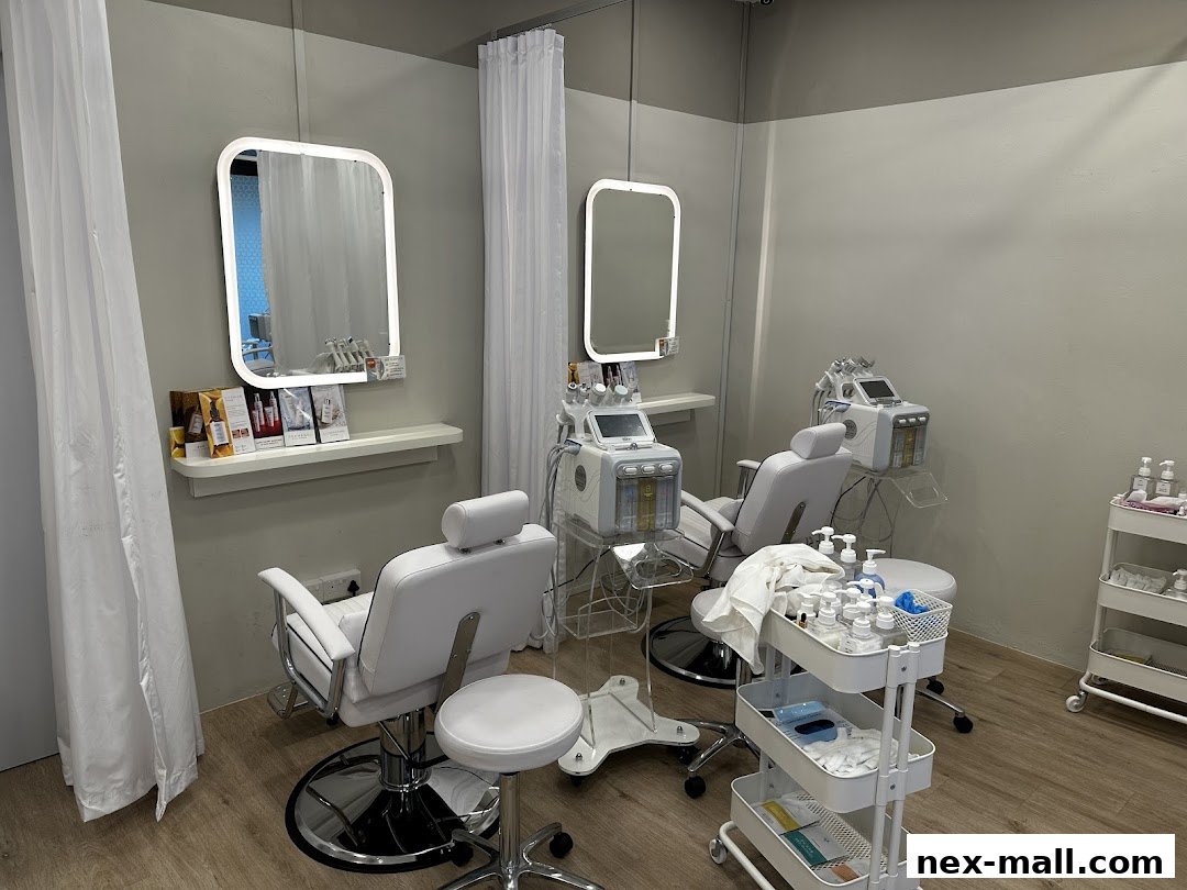 Interior of a clean, modern Korean facial spa with treatment chairs and equipment.