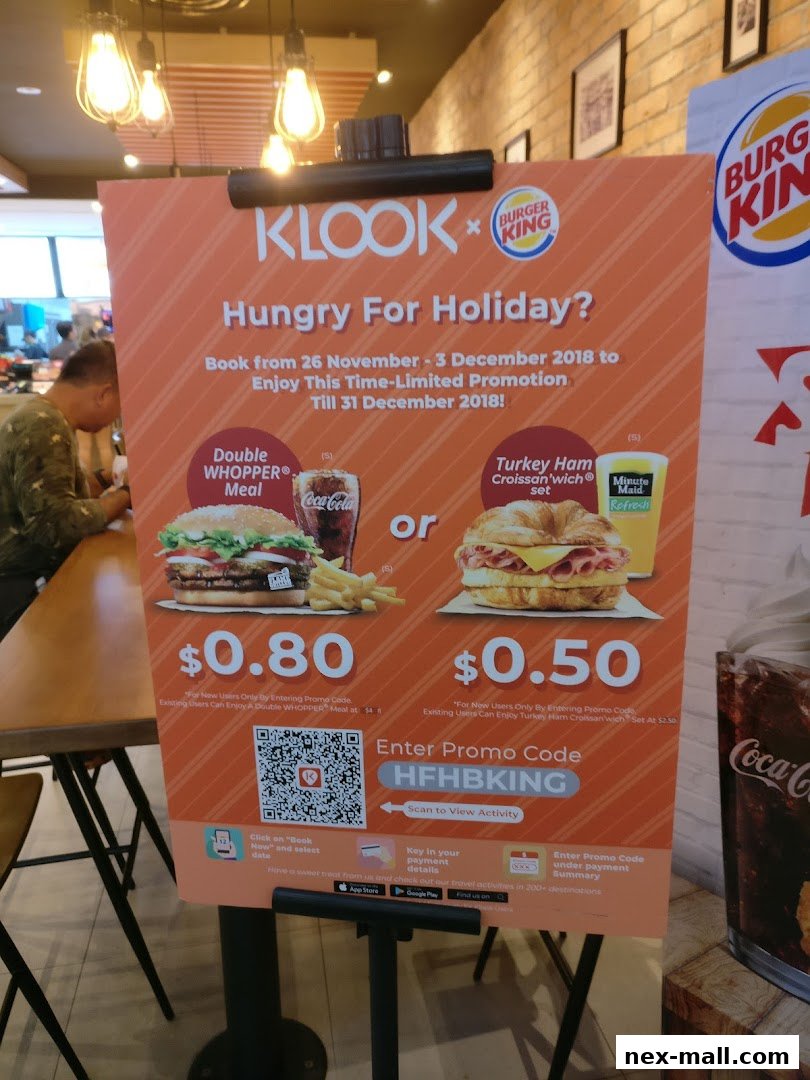 A promotional sign for Burger King offering special deals on meals.