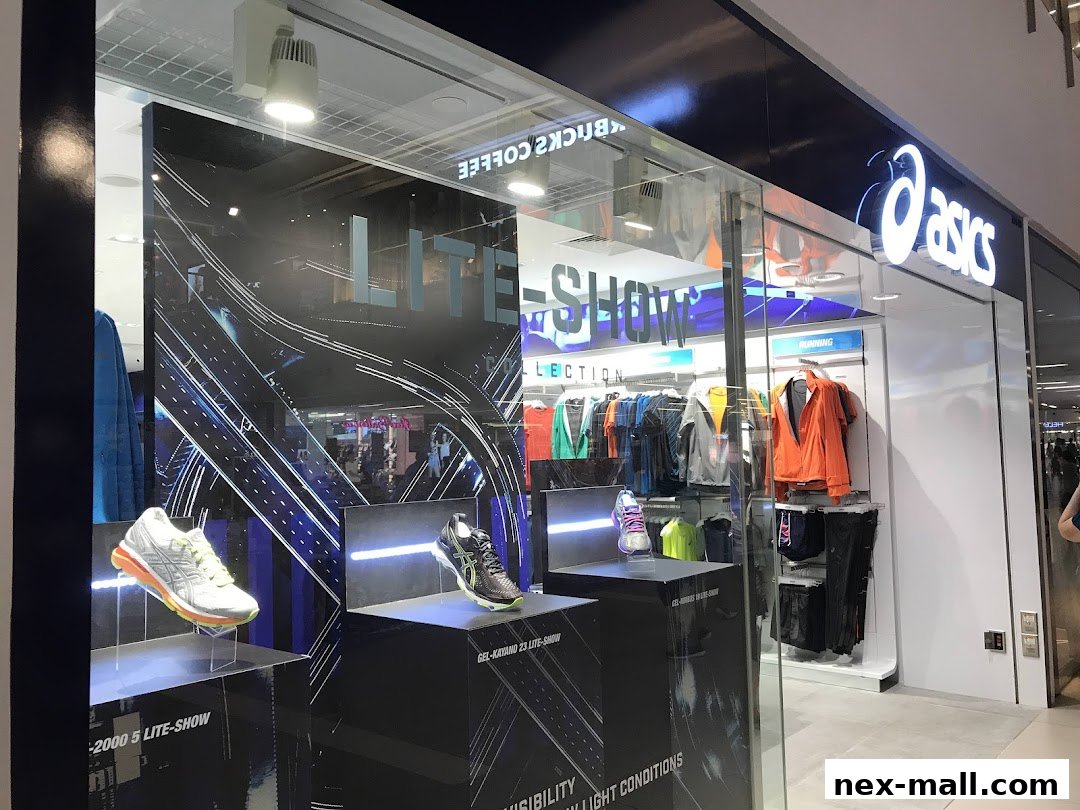 The ASICS store features a window display with running shoes and apparel, showcasing the Lite-Show collection.