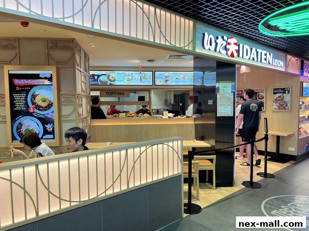 Idaten Udon Serangoon NEX shop interior with customers and staff serving food.