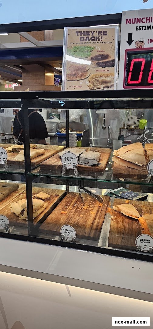 A display case filled with various flavors of pancakes at Munchi Pancakes.