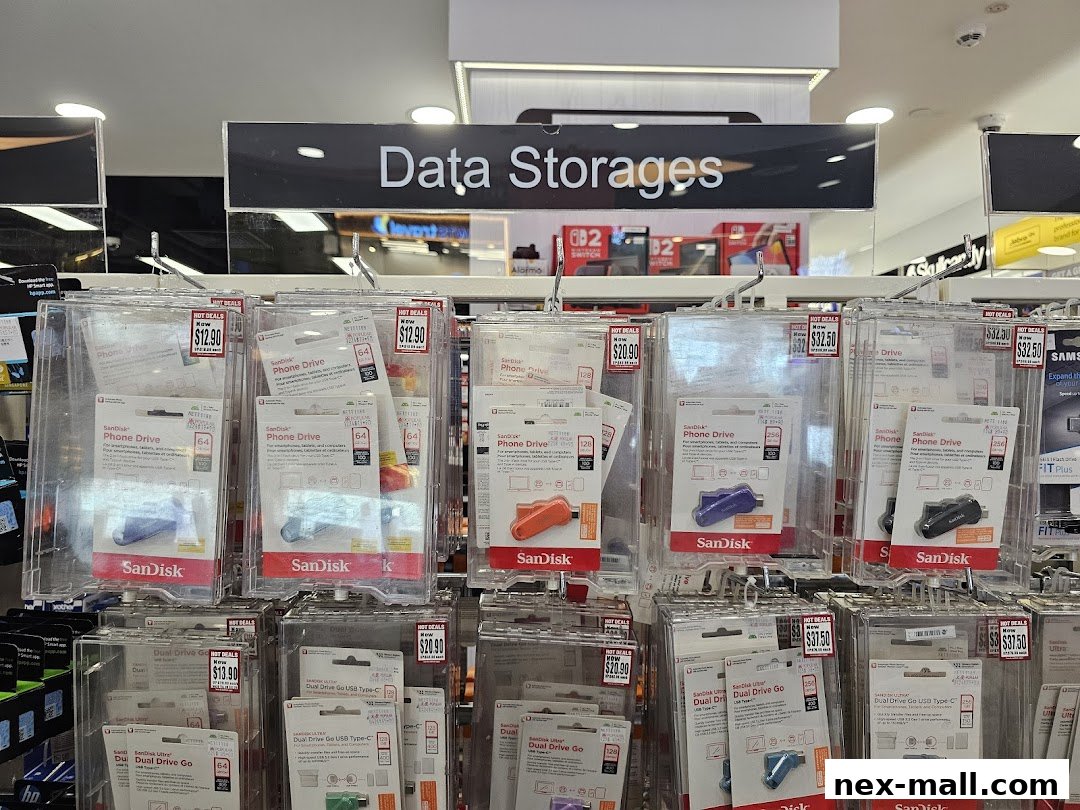A display of SanDisk phone drives and dual USB Type-C drives with prices.