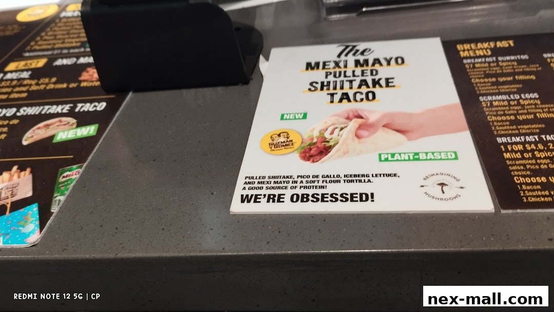 A menu board featuring the new Mexi Mayo Pulled Shiitake Taco and breakfast options.