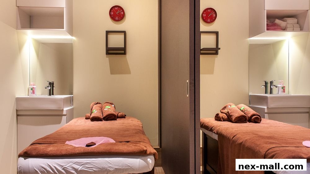 Two spa beds are set up with towels and sinks, ready for treatments.