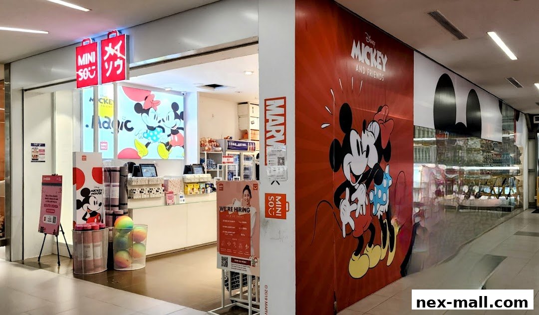 The entrance of a MINISO store featuring Disney's Mickey and Friends.