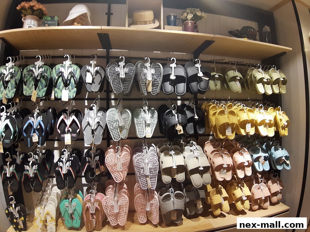 A wide selection of colorful flip-flops and sandals displayed on shelves.