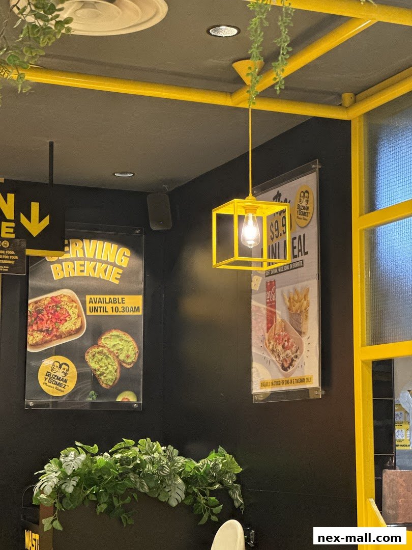 Interior shot of Guzman y Gomez with promotional posters and decor.