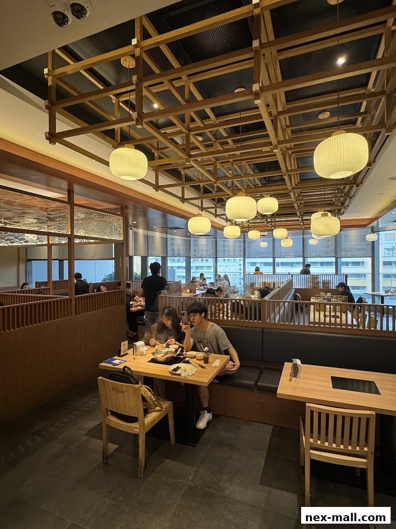 Interior view of a Shabu Sai restaurant with diners enjoying hot pot.