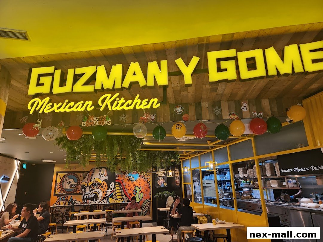 Interior of Guzman y Gomez Mexican Kitchen with festive decorations and diners.