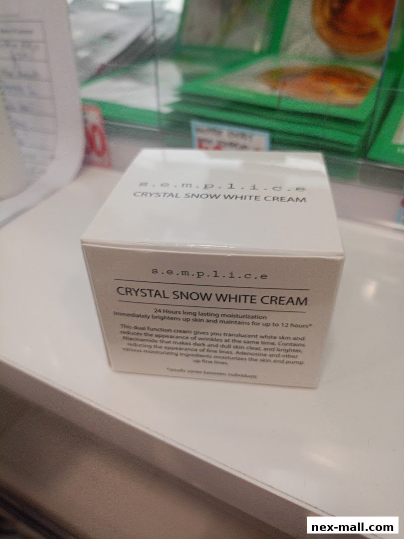 A box of S.E.M.P.1.I.C.E Crystal Snow White Cream skincare product.