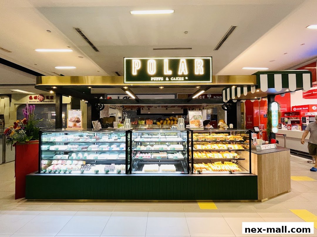 A Polar Puffs & Cakes shop with a display of various pastries and cakes.